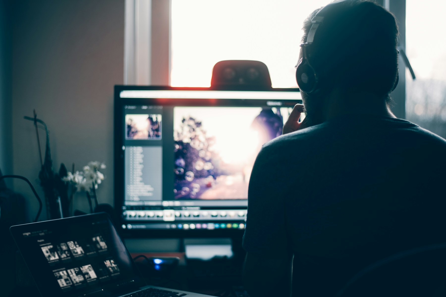 Photographer reviewing and editing images at a computer workstation